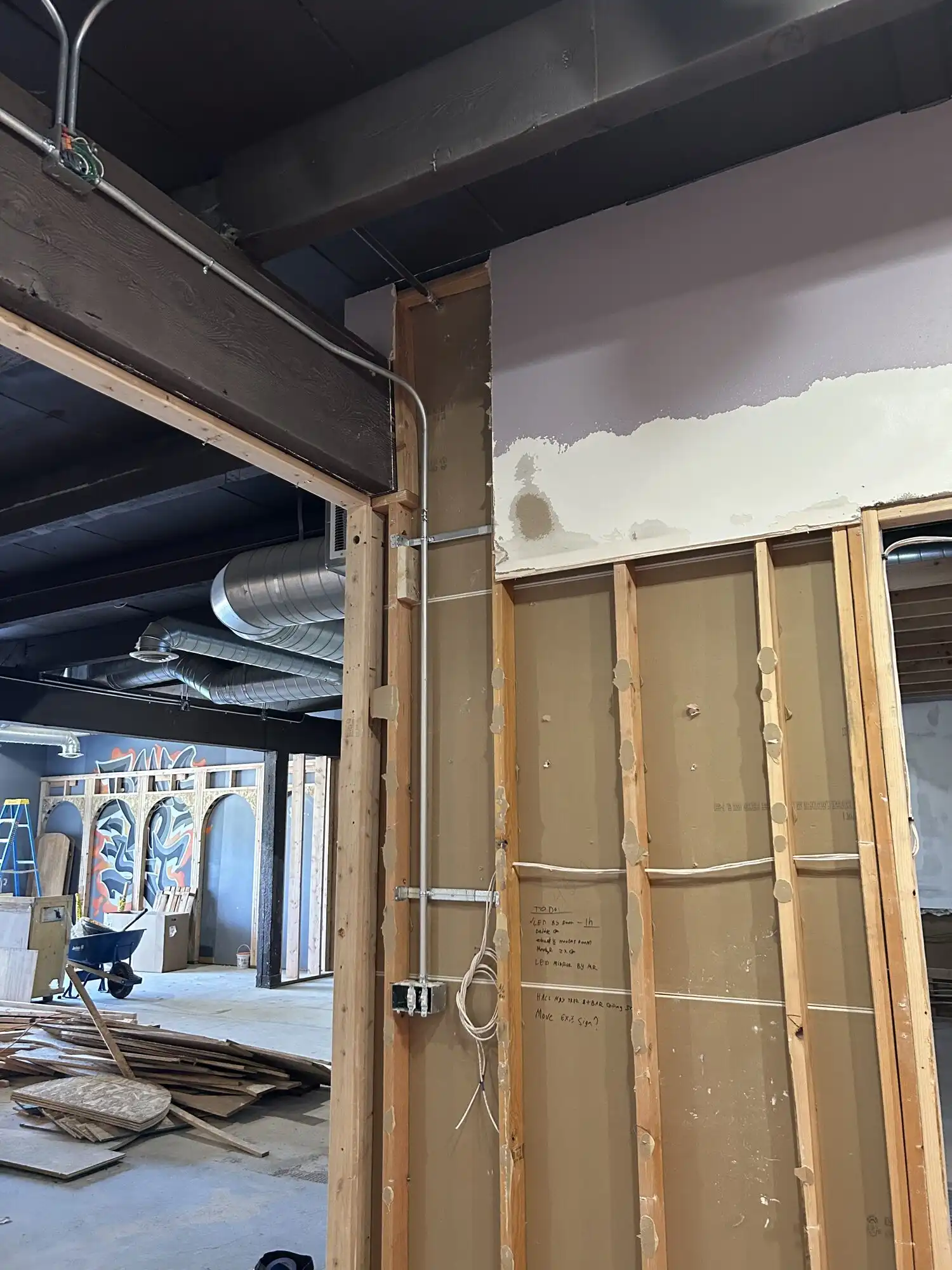 Parallel EMT conduit runs and boxes in a framed wall, Federal Way restaurant tenant improvement
